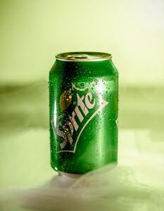 Shot of a Sprite can with mist effect showcasing refreshing qualities.